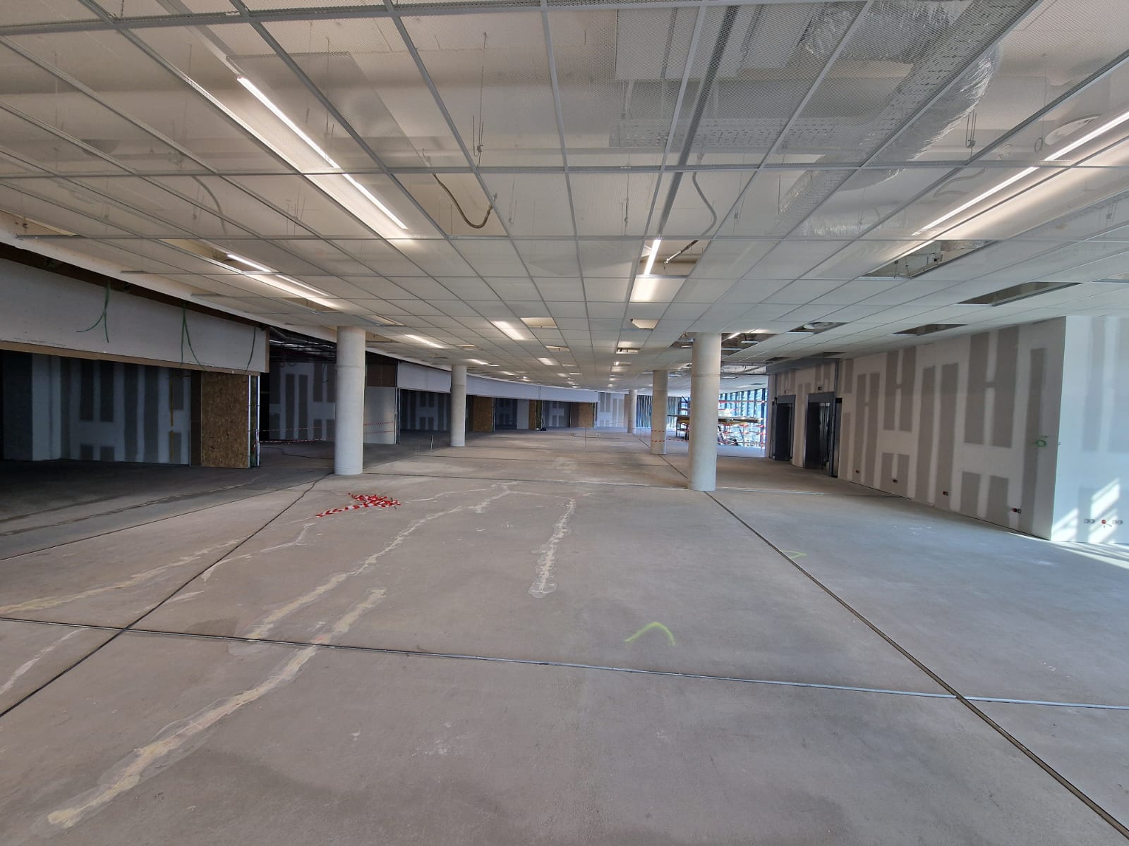 Raw concrete substrate prepared for the terrazzo pour at Zaventem Airport