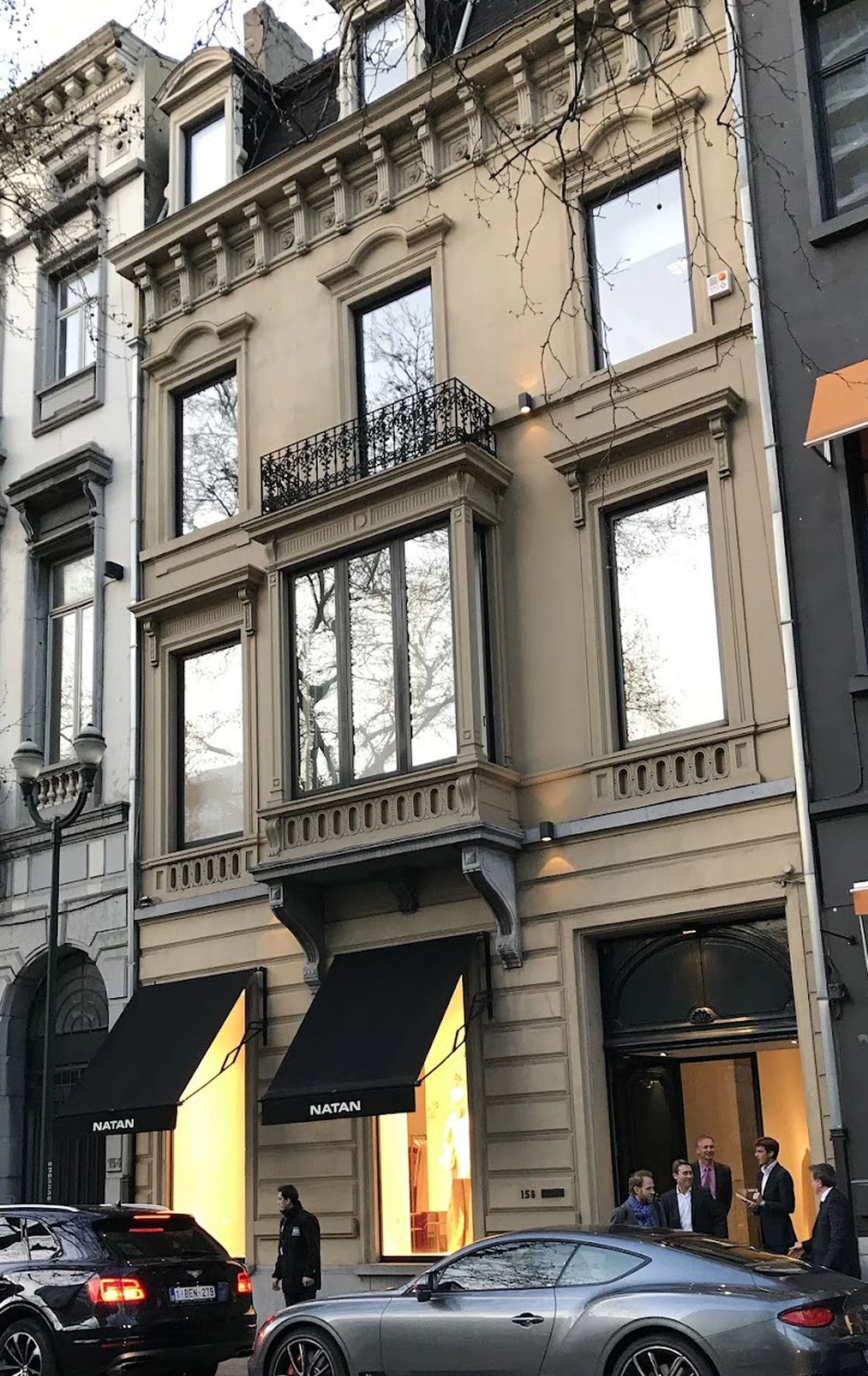Exterior of the Natan fashion house storefront in Brussels, with awnings and boutique windows