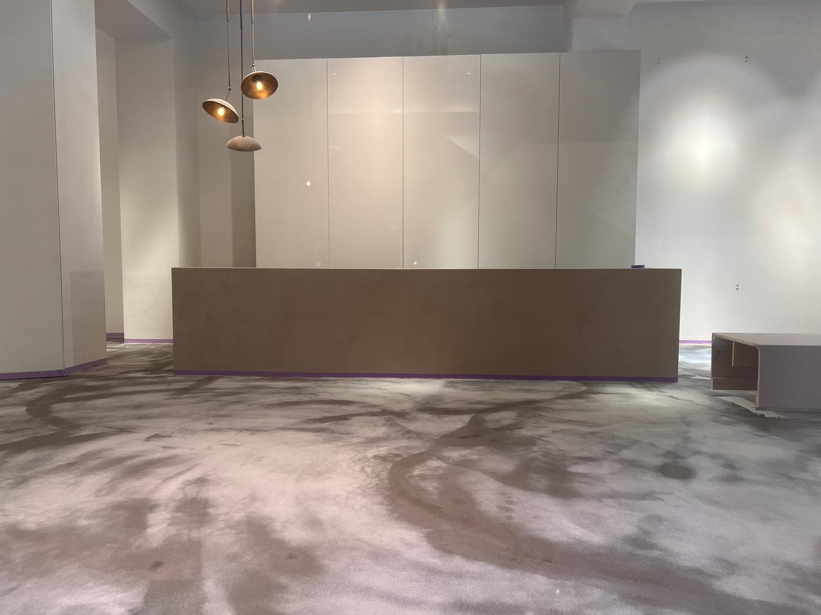 Freshly poured seamless mineral floor in the Natan luxury store in Brussels, during fit-out